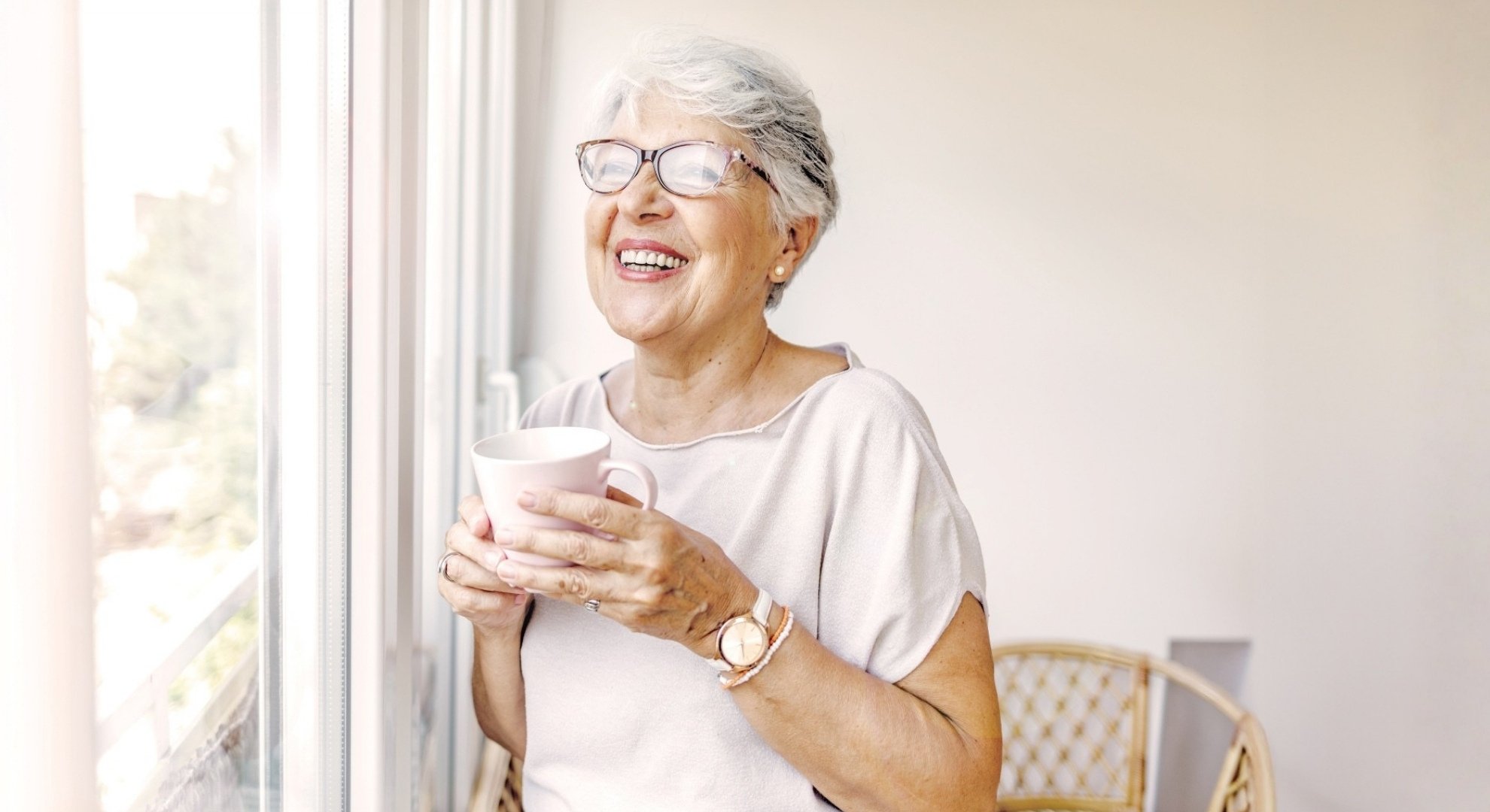 Senior woman holding cup of tea